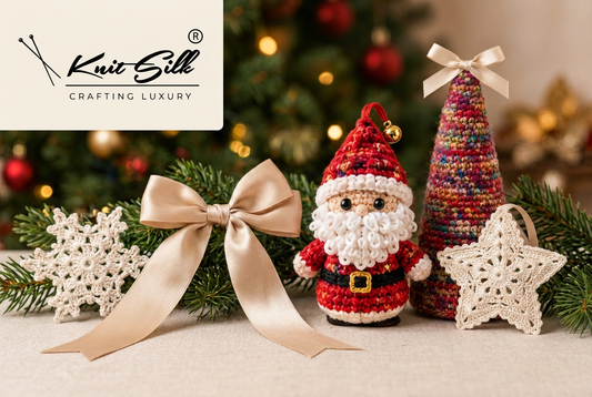 KnitSilk Christmas concept hero with script logo, Santa ornament, multicolour sari silk tree, champagne bow, silk star and snowflake