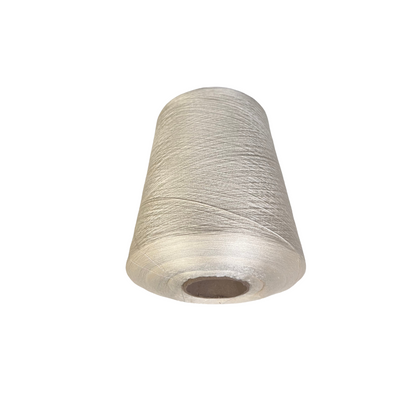 Spool of white thread on a white background