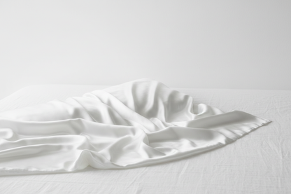 Hero – White Silk Pillowcase on Bed